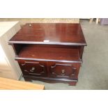 A reproduction mahogany TV stand