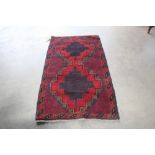 An approx. 4'9" x 2'9" Balochi rug