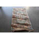 An approx. 5'7" x 3' floral patterned Chinese wool