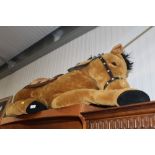 A large stuffed toy in the form of a horse