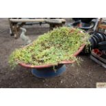 A vintage Victorian hip bath and contents of plants