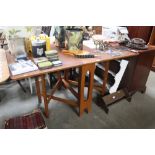 A teak drop leaf table