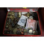 A tin of various coinage and bank notes
