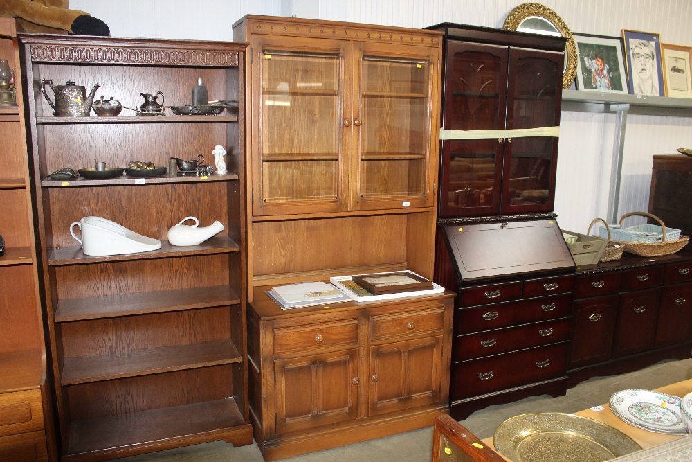 An Ercol dressed raised on cupboard base fitted tw