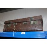 A leather bound suitcase by Bick Brothers Cheltenh