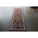An approx. 5'9" x 2'1" Chobi Kilim rug