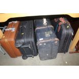 A wooden and metal bound travelling trunk and thre