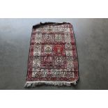 An approx. 3'7" x 2'3" Eastern patterned rug