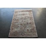 An approx. 5' x 3' floral patterned wool rug