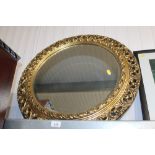 A gilt framed circular bevel edged wall mirror