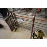 A wooden five rail towel rail