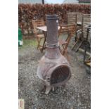 A cast iron garden chimenea