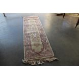 An approx. 7'11" x 2'4" Chinese wool runner