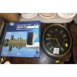 A wall clock together with a Houses of Parliament