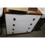 A wood effect chest fitted four drawers