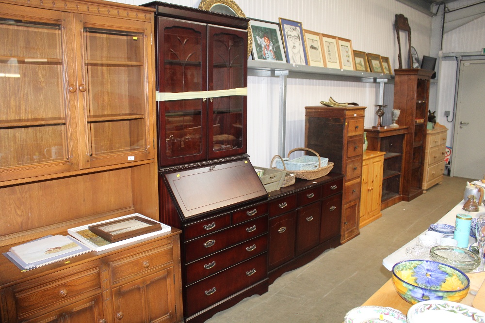 A sideboard fitted three drawers together with a b