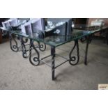 A glass top metal framed coffee table