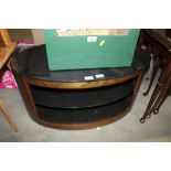 An oval TV stand
