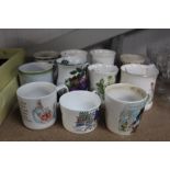 A quantity of mugs to include Peter Rabbit, Wedgwo