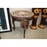 A decorative inlaid elephant table