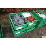 Six plastic trays containing a large quantity of m