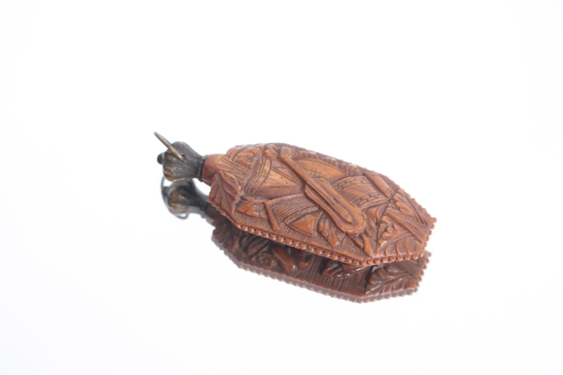 An unusual carved treen scent bottle, decorated on