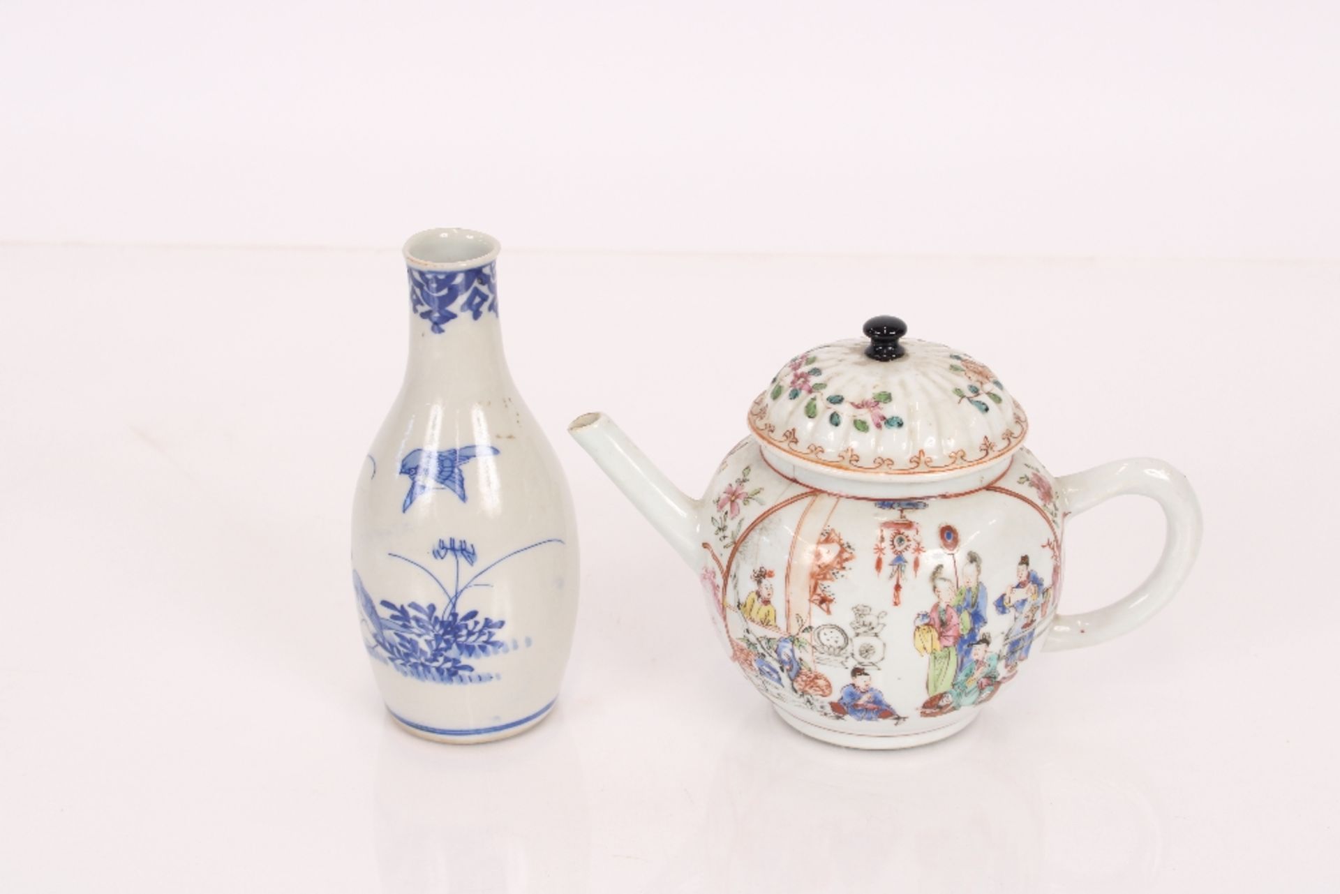 A 18th century Chinese famille rose teapot decorated with figures; an oriental blue and white floral