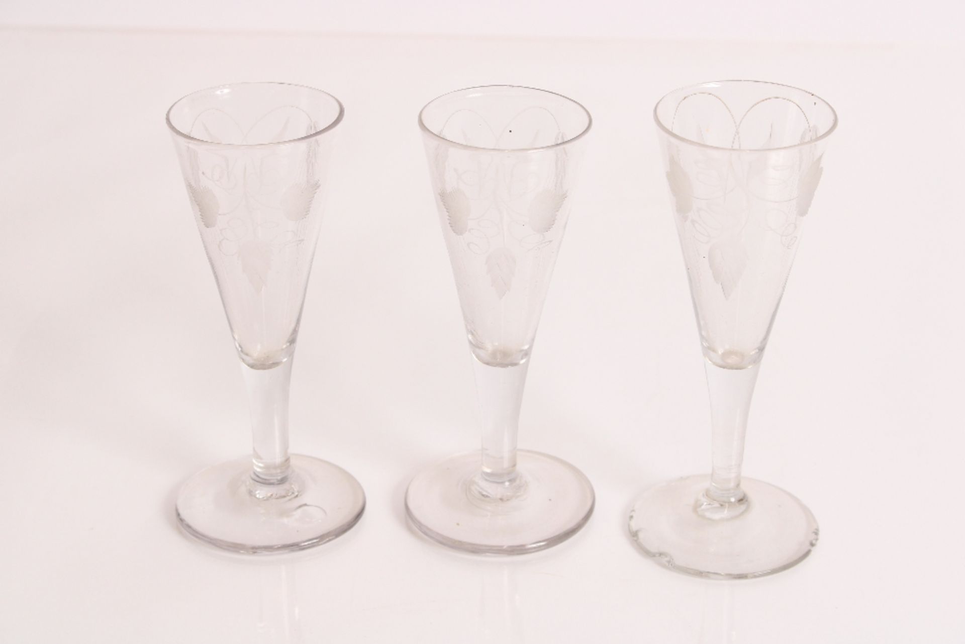 Four 19th century glasses of conical shape with fo