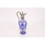 A Victorian blue overlaid glass and silver mounted claret jug, foliate decoration to the mounts