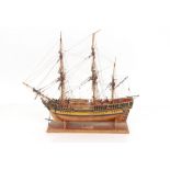 A wooden model of HMS Bounty, 57cm long overall x