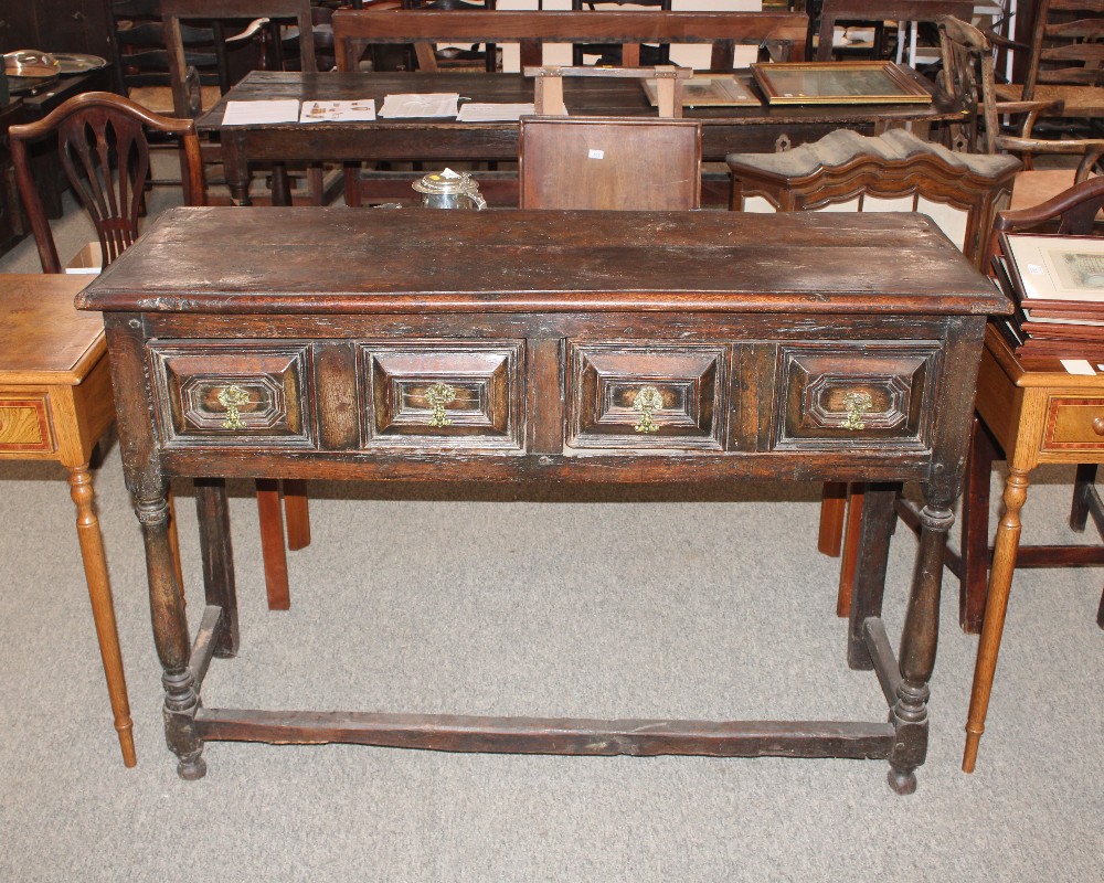 An 18th century oak dresser base, fitted with a pa