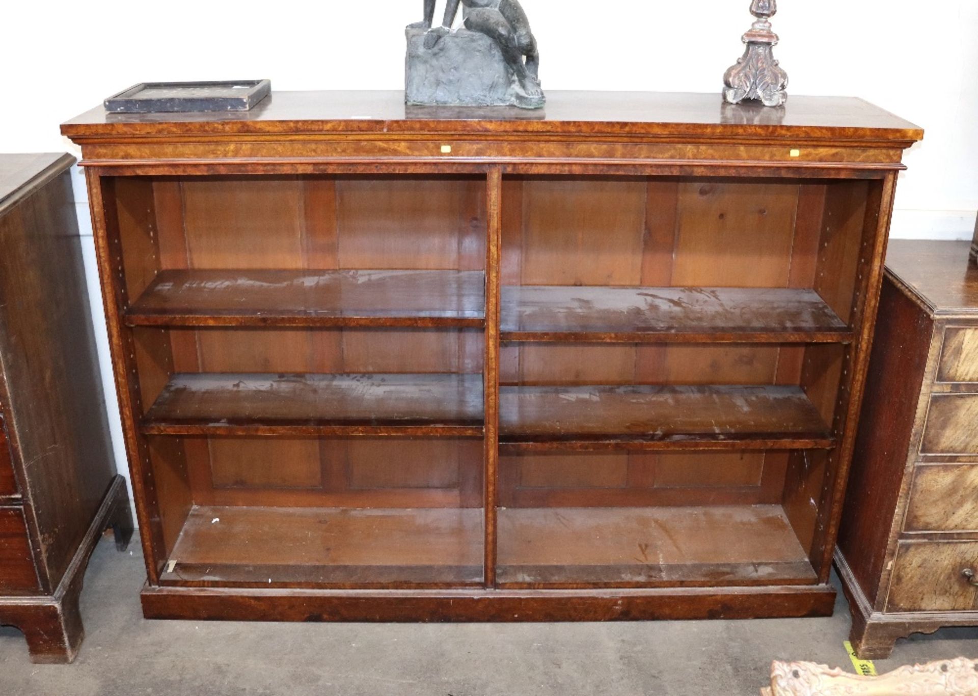 A Victorian burr walnut open fronted bookcase, fit