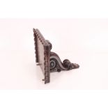 An ornately carved rosewood clock bracket, 32cm wi