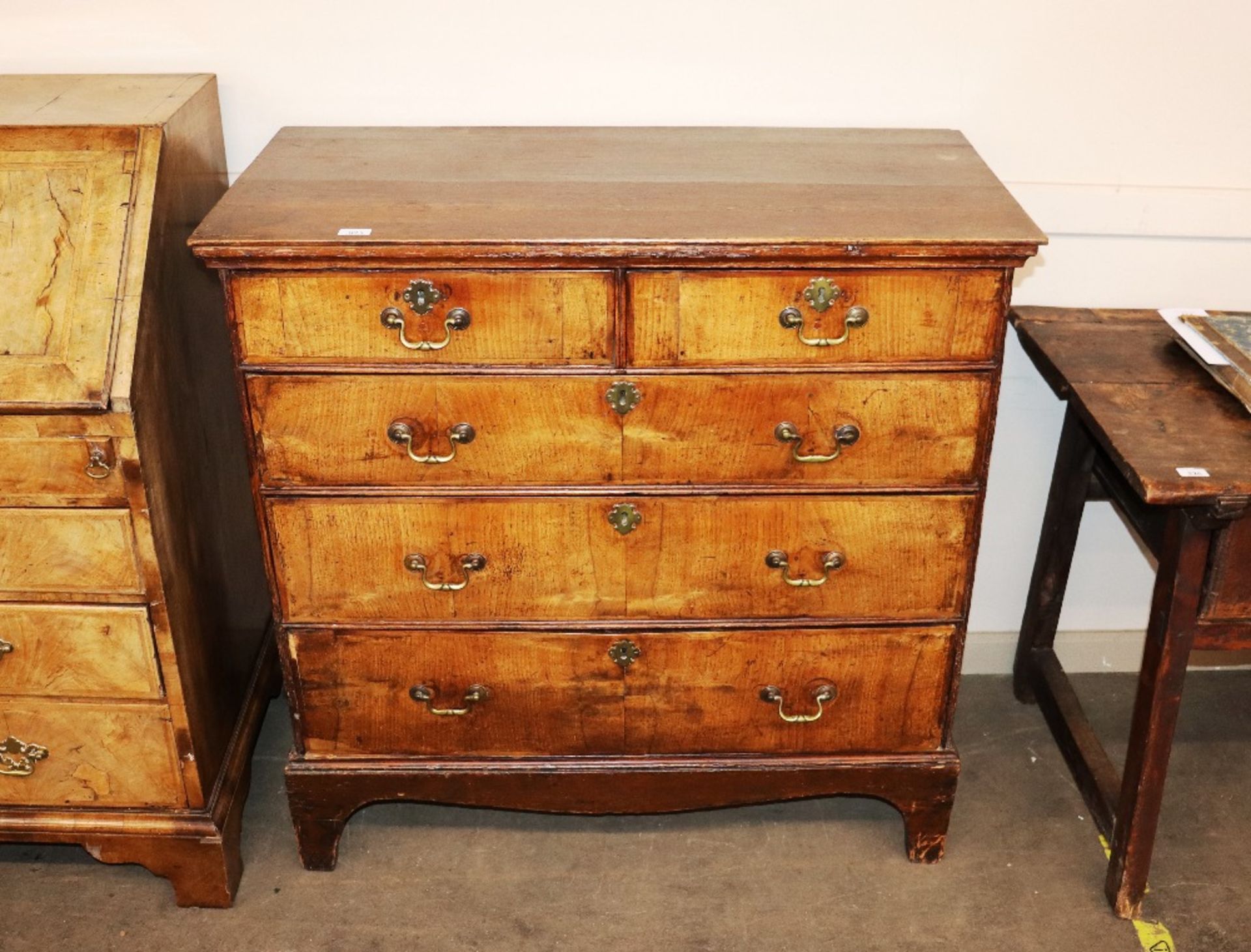 An 18th century walnut chest of two short and thre