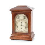 A Victorian oak cased chiming mantel clock, having silver dial with subsidiaries, 43cm high