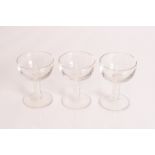 Three saucer shaped glasses with air and cotton tw