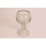 A large 19th century cut glass goblet with floral