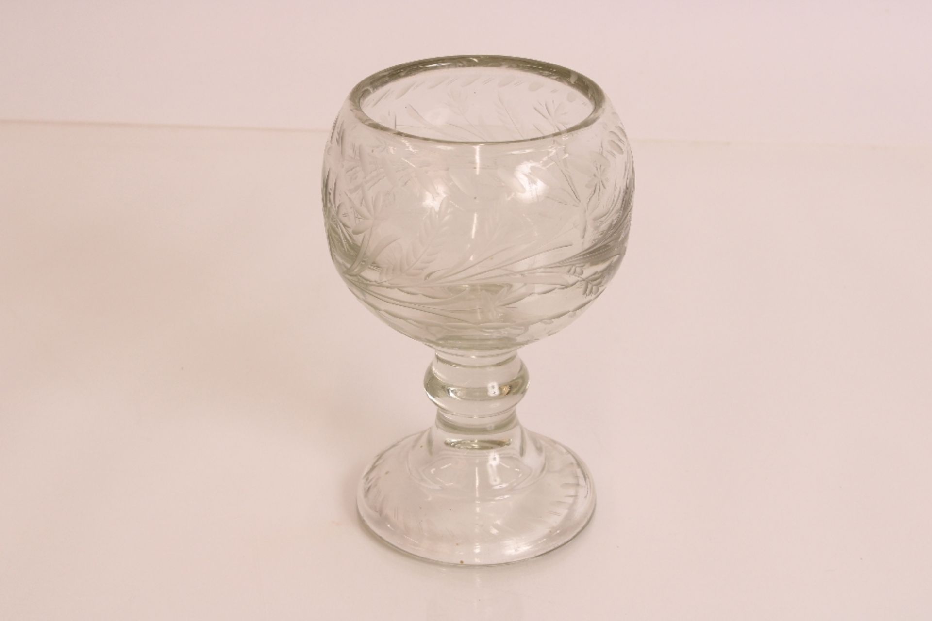 A large 19th century cut glass goblet with floral