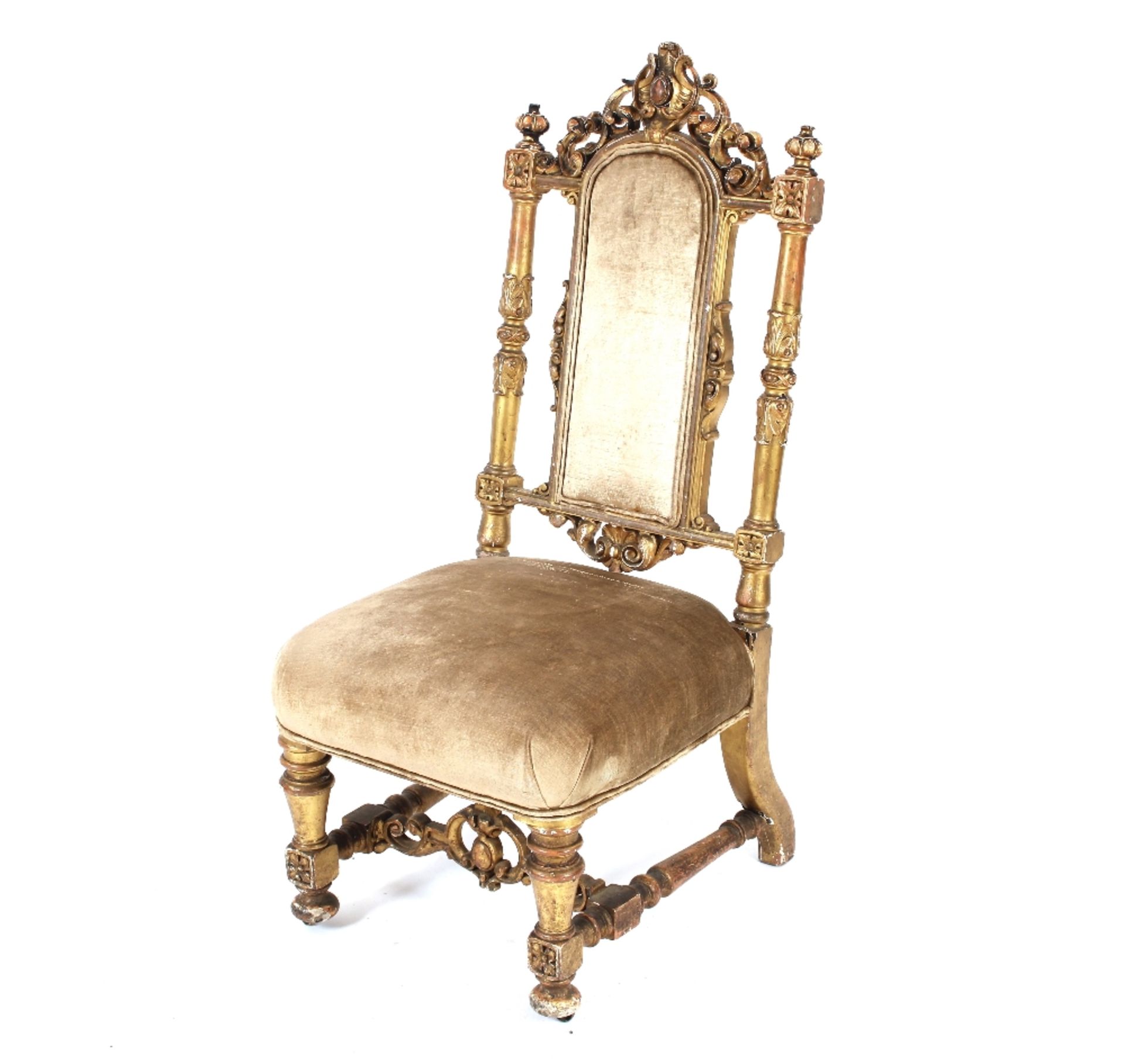 A Victorian carved and gilded nursing chair