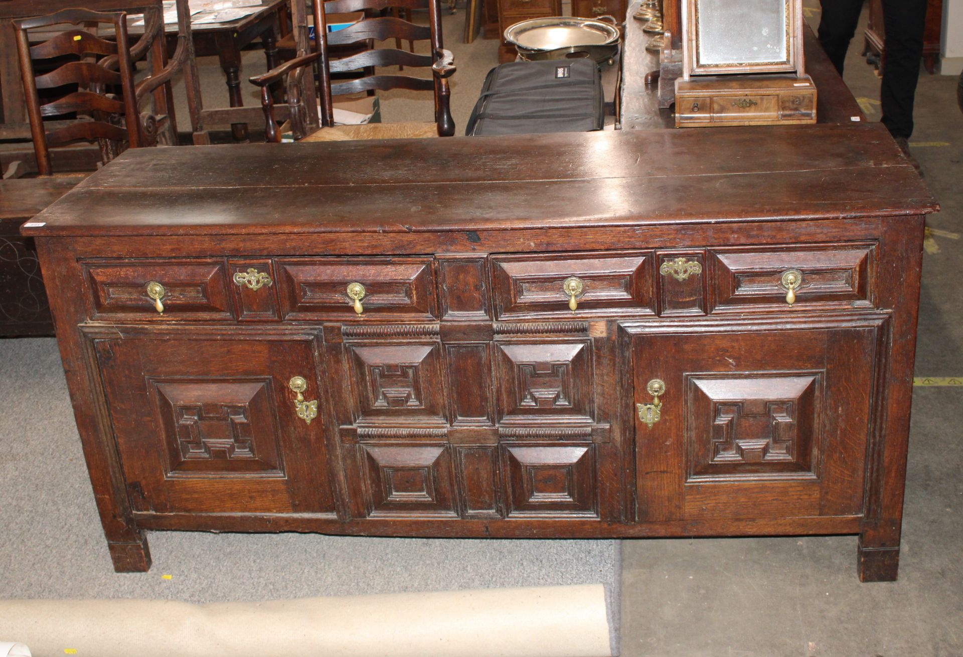An 18th century oak dresser base, the drawers and