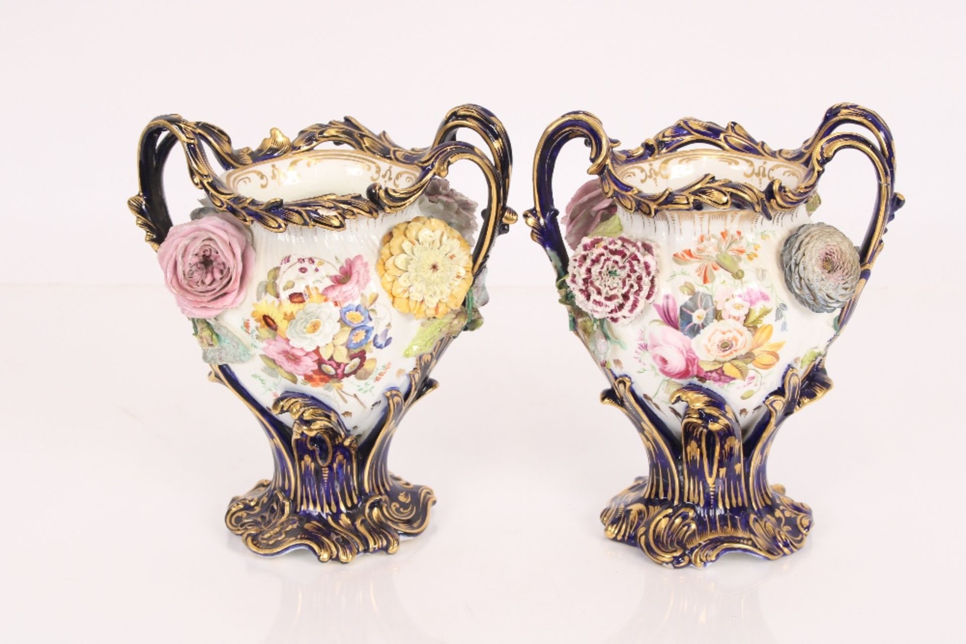 A pair of 19th century Coalport type baluster vase