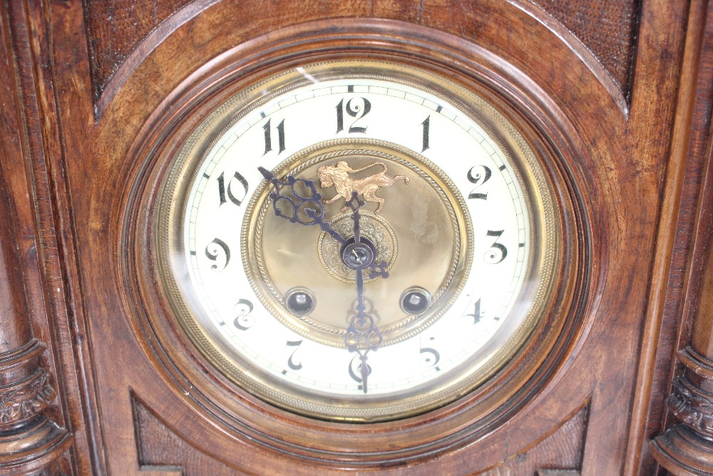 A late Victorian walnut cased mantel clock, eight - Image 2 of 2