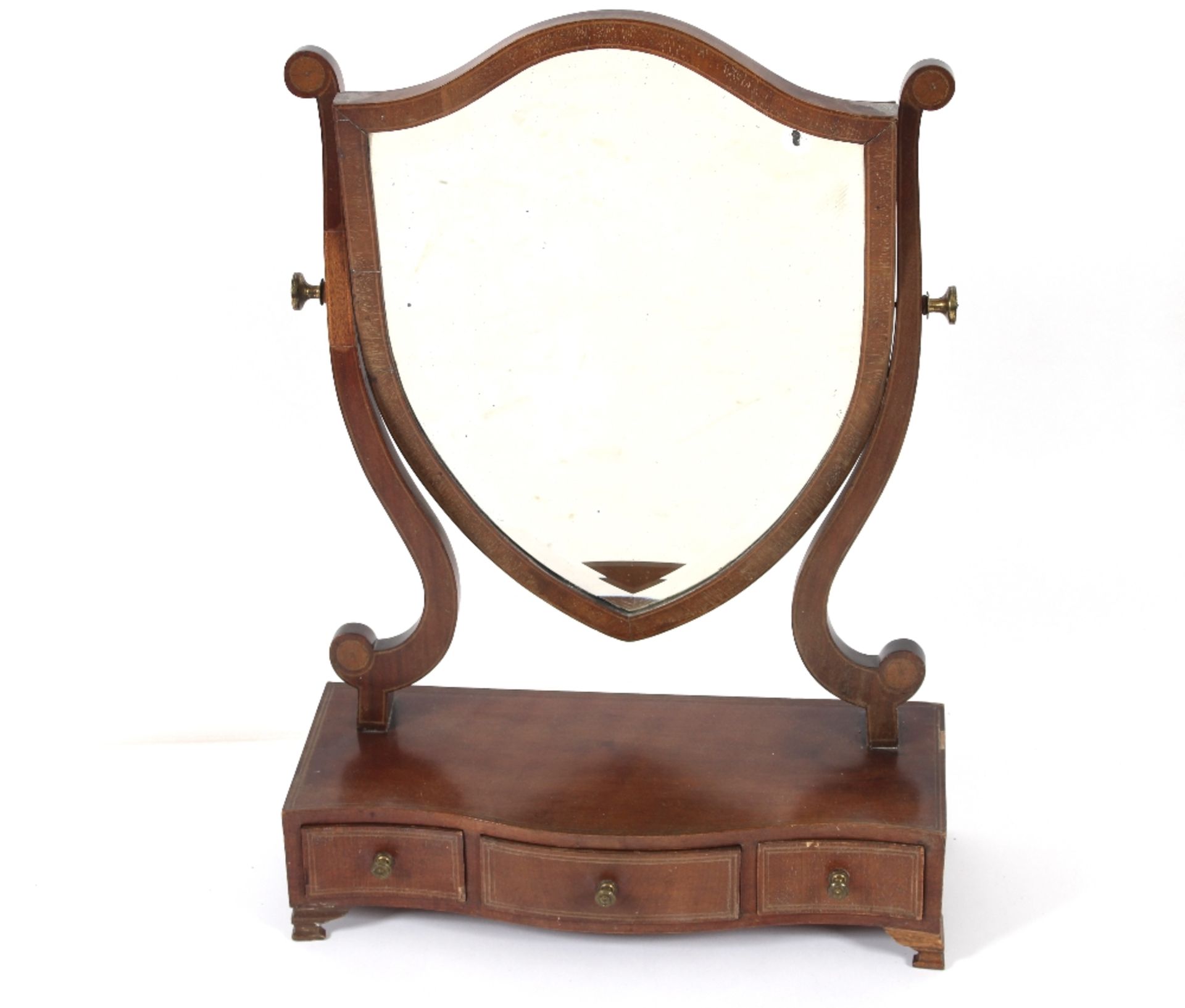 A mahogany swing toilet mirror, having bevelled sh