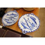 A pair of Faience type fish draining dishes