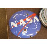 A reproduction Nasa enamel sign