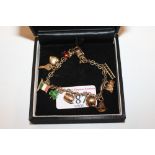 A 9ct gold charm bracelet with 9ct gold charms, approximate total weight 13g