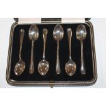 A cased set of six silver coffee spoons and a silv