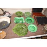 A quantity of green glazed leaf ware plates
