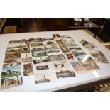 A box containing approx. forty postcards, mostly r