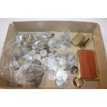 A box containing various coinage, two lighters and